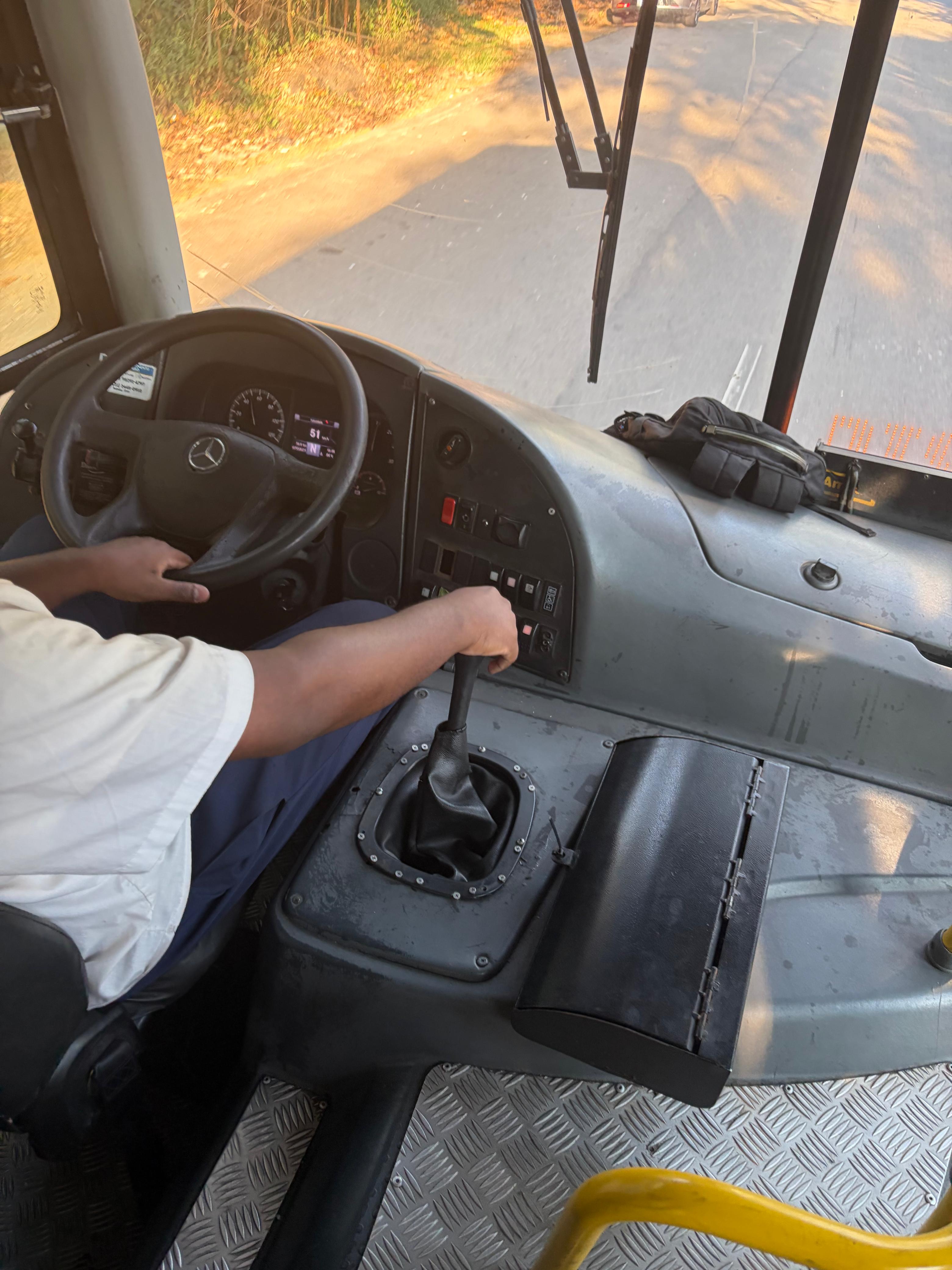 Standing in the bus while figuring out the system.